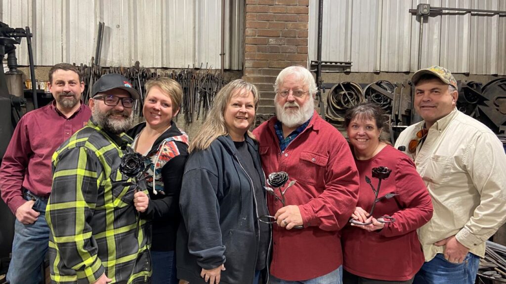 The three couples from the blacksmithing event and the instructor Lonnie Jensen at the Shadow Mountain Forge in Collinston, Utah.