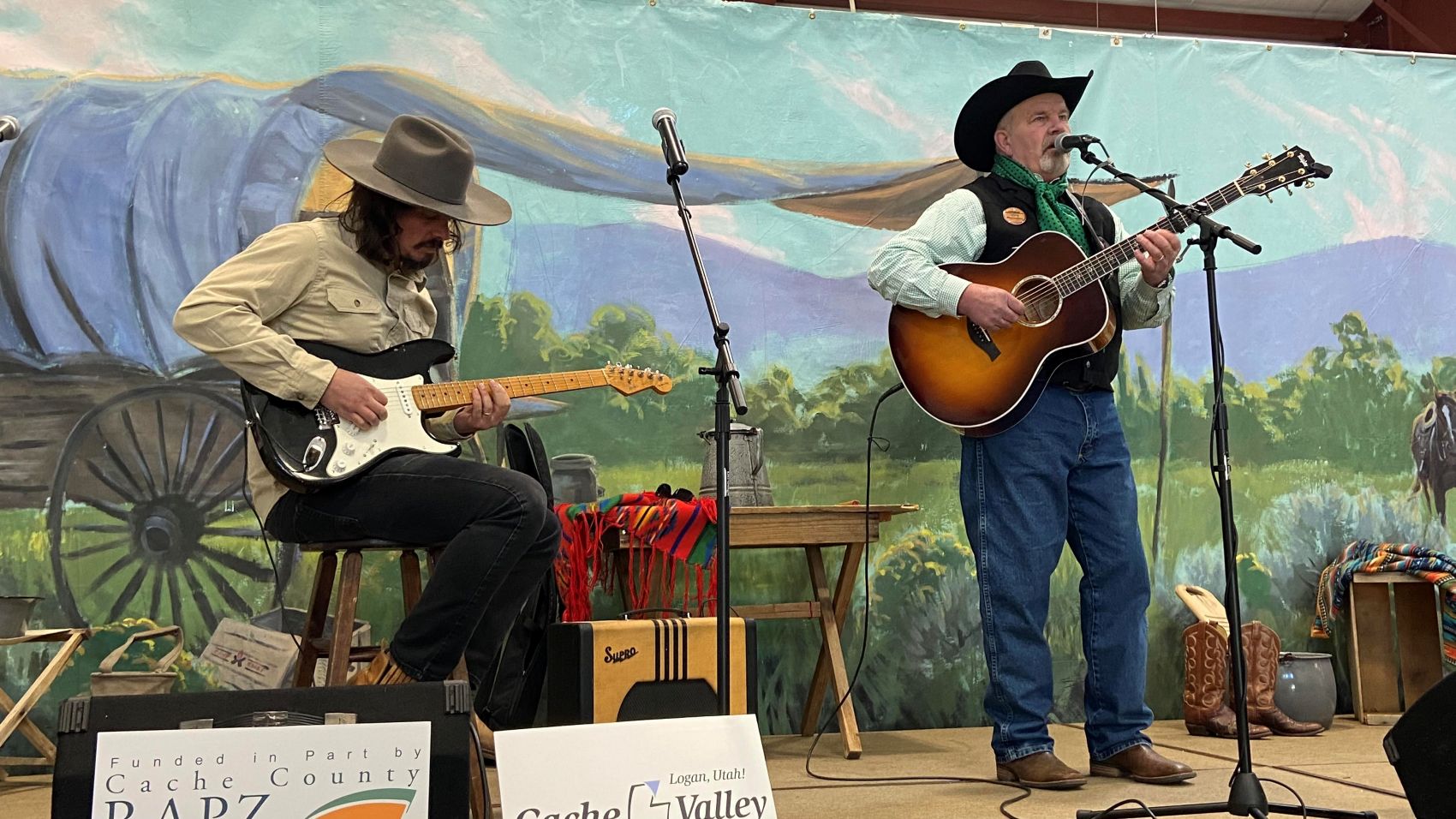 Two musicians performing at the Cache Valley Cowboy Rendezvous in Logan, Utah.