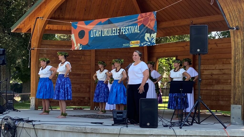 Dancers from the Halau Hula O Ka Ahumanu preparing to perform at the 2026 Utah Ukulele Festival in Logan, Utah.