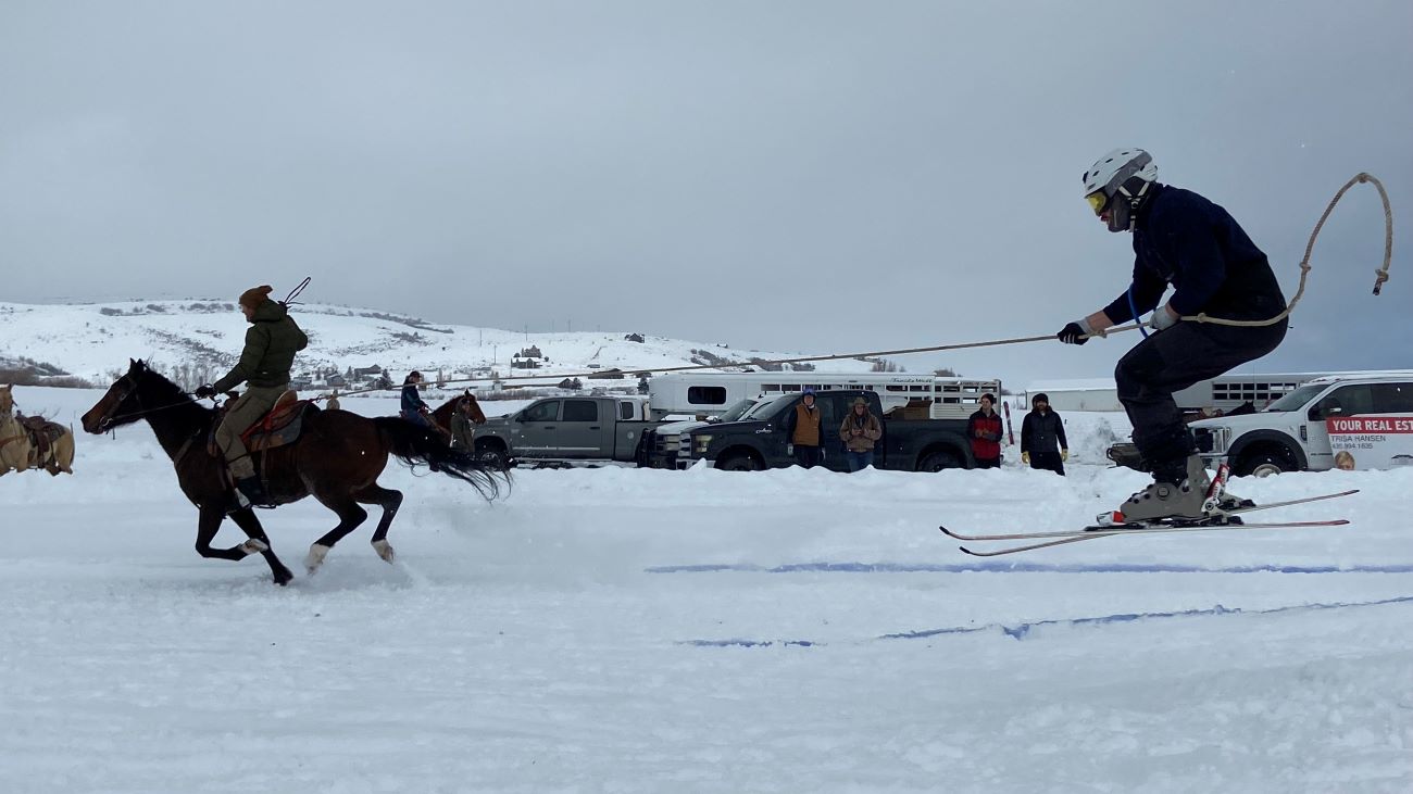A skier being pulled behind a horse in Garden City, Utah.